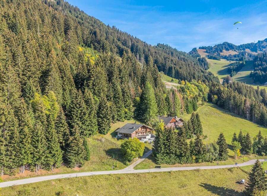 Nestled amidst a lush alpine forest, this charming property offers a serene mountain retreat.