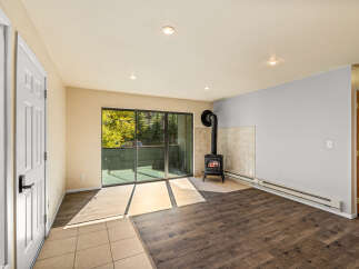 Cozy living space featuring a charming wood-burning stove, perfect for chilly evenings.