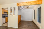 Discover this charming home featuring a modern kitchen with ample cabinet space and a sleek countertop.