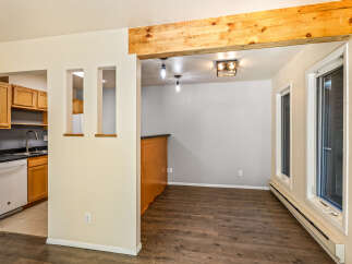Discover this charming home featuring a modern kitchen with ample cabinet space and a sleek countertop.