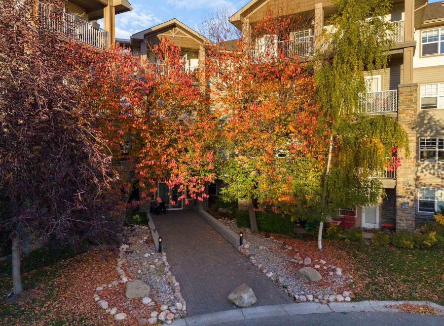 Experience the beauty of autumn with this stunning property, featuring vibrant fall foliage that creates a picturesque setting.