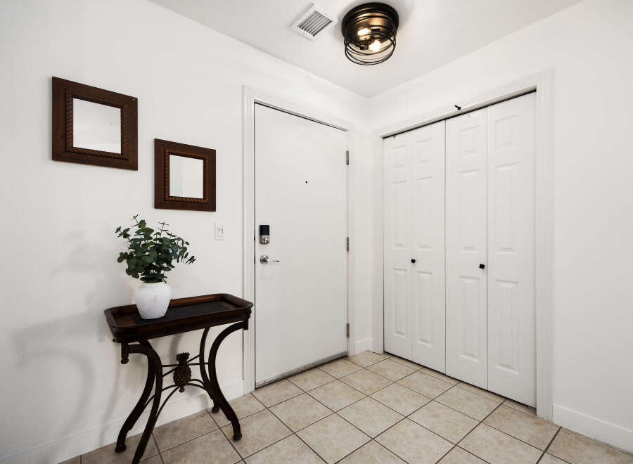 Step into this welcoming entryway featuring a smart lock on the front door for enhanced security.