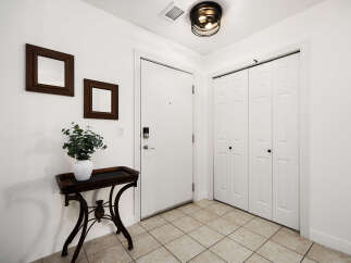 Step into this welcoming entryway featuring a smart lock on the front door for enhanced security.