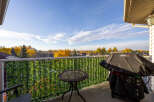 Enjoy outdoor living on this charming balcony, complete with a Weber grill perfect for summer cookouts.