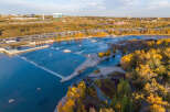 Experience the vibrant autumn colors surrounding this stunning waterfront property.