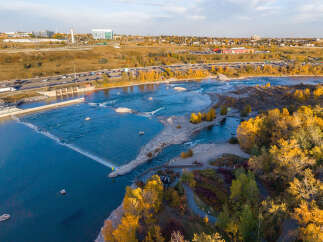 Experience the vibrant autumn colors surrounding this stunning waterfront property.