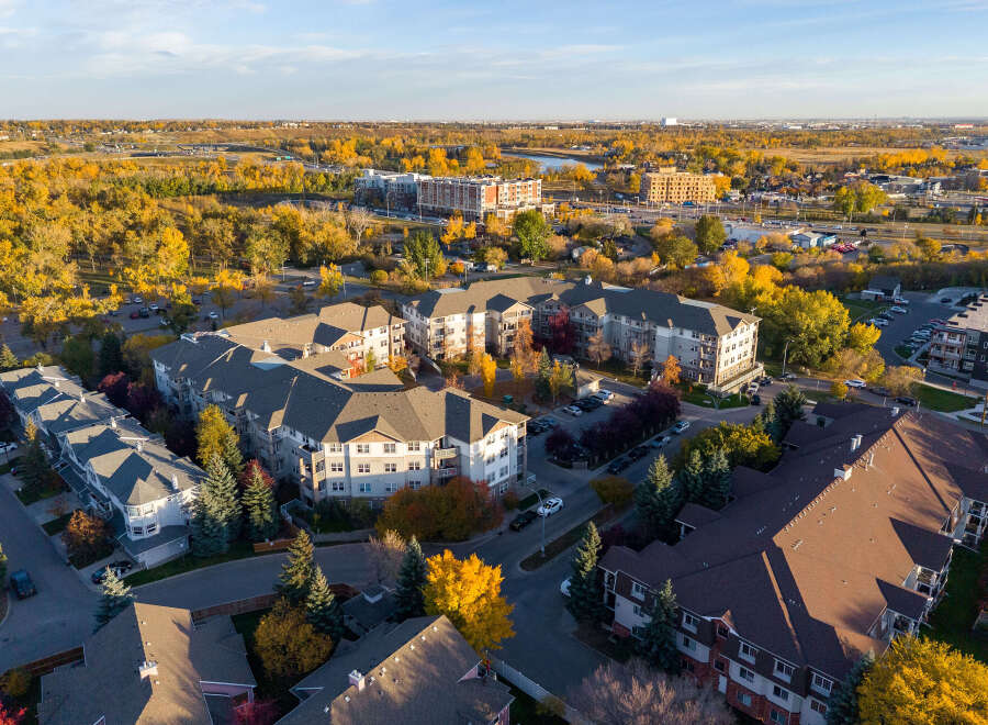 Experience modern living in this stunning apartment complex, nestled amidst vibrant autumn foliage.