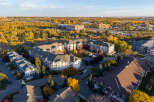 Experience modern living in this stunning apartment complex, nestled amidst vibrant autumn foliage.