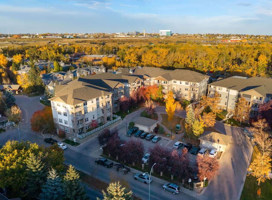 Experience modern living in this stunning apartment complex, nestled amidst vibrant autumn foliage.