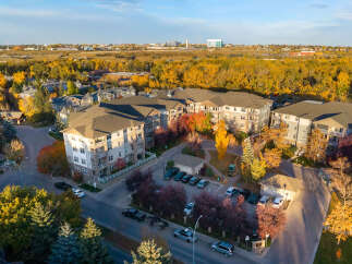 Experience modern living in this stunning apartment complex, nestled amidst vibrant autumn foliage.