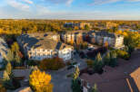 Experience modern living in this stunning apartment complex, bathed in the warm glow of autumn.