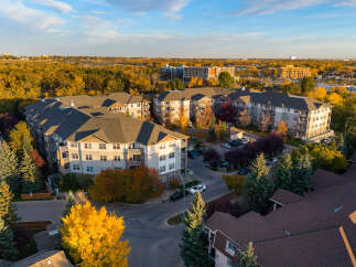 Experience modern living in this stunning apartment complex, bathed in the warm glow of autumn.