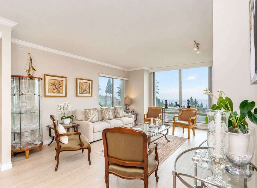 Experience breathtaking ocean and forest views from this stunning living room.