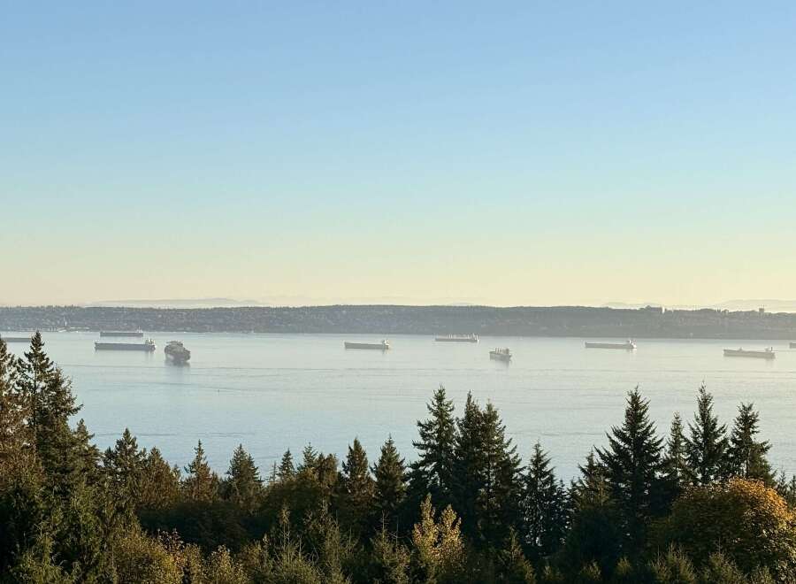 Experience breathtaking panoramic views of the water and distant mountains from this stunning property.