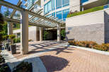 Welcome to this stunning property featuring a modern entrance with a covered walkway and elegant landscaping.