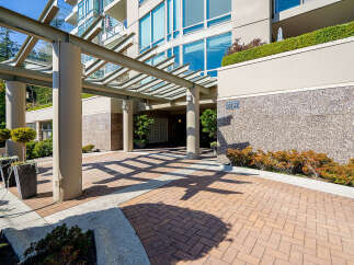 Welcome to this stunning property featuring a modern entrance with a covered walkway and elegant landscaping.