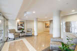 Step into this elegant lobby featuring comfortable seating areas perfect for residents and guests.