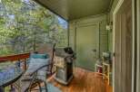 Enjoy outdoor living on this charming deck, complete with a grill for summer barbecues and comfortable seating for relaxation.