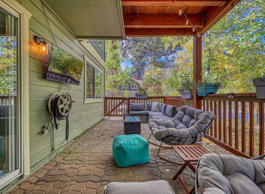 Enjoy outdoor living on this spacious covered patio, perfect for entertaining or relaxing.