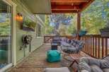 Enjoy outdoor living on this spacious covered patio, perfect for entertaining or relaxing.