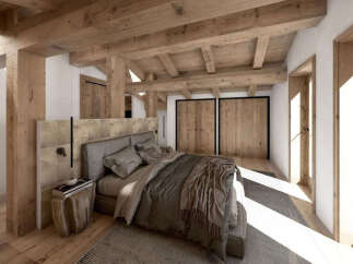 Experience rustic luxury in this beautifully designed bedroom, featuring exposed wooden beams and a cozy, inviting atmosphere.