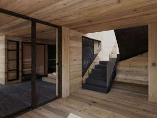 Experience modern luxury in this stunning home featuring a sleek, dark stone staircase with glass railings, complemented by warm, natural wood paneling throughout.