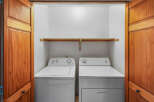 Discover the convenience of a dedicated laundry space featuring a top-load washer and a front-load dryer, perfect for handling all your laundry needs.