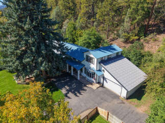 Experience the charm of this stunning property nestled amidst lush greenery and mature trees.