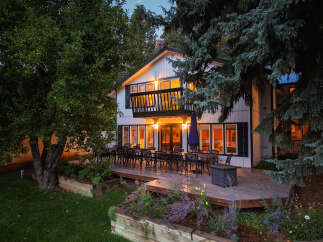 Enjoy evenings on the expansive deck of this charming home, perfect for entertaining guests or relaxing with family.