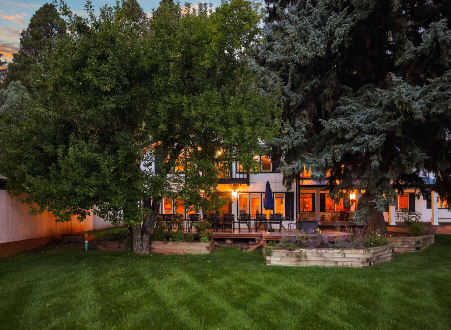 Experience the charm of this beautiful home, featuring a spacious deck perfect for outdoor entertaining and relaxation.