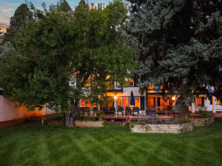 Experience the charm of this beautiful home, featuring a spacious deck perfect for outdoor entertaining and relaxation.