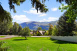 Experience the serene beauty of this property, nestled amidst lush greenery and mature trees.
