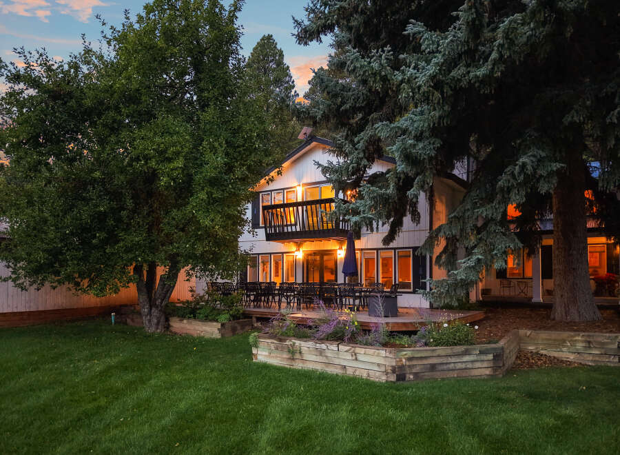 Enjoy evenings on the expansive deck of this beautiful home, perfect for entertaining guests.