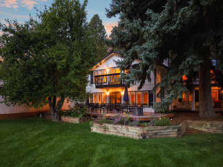 Enjoy evenings on the expansive deck of this beautiful home, perfect for entertaining guests.