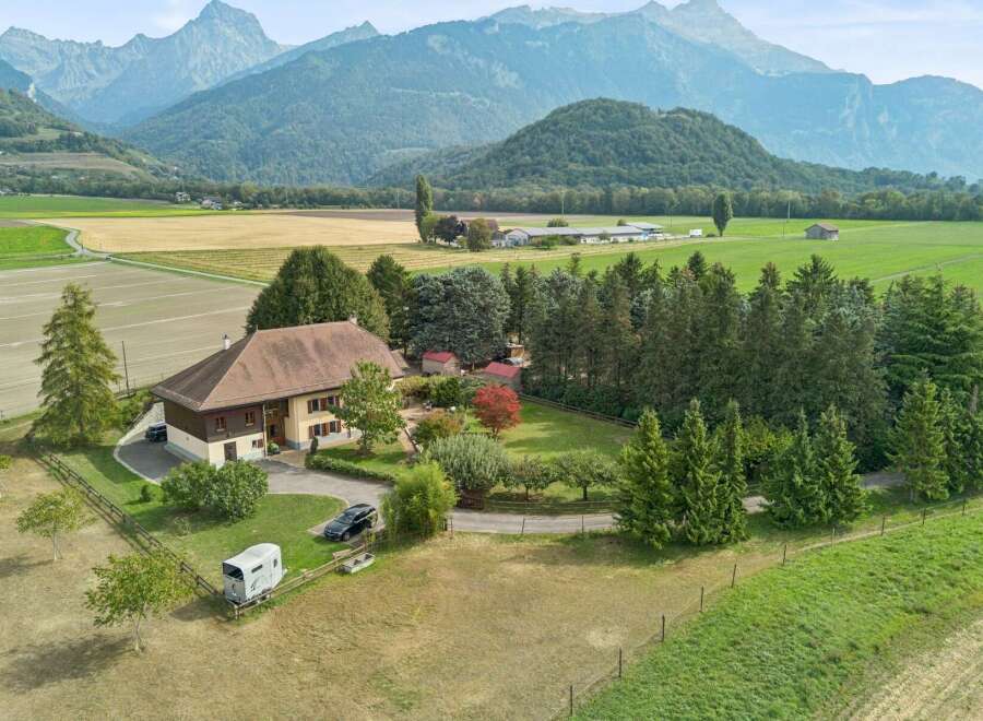 Experience serene country living with this charming property nestled amidst rolling hills and majestic mountains.