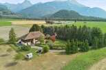 Experience serene country living with this charming property nestled amidst rolling hills and majestic mountains.