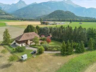 Experience serene country living with this charming property nestled amidst rolling hills and majestic mountains.