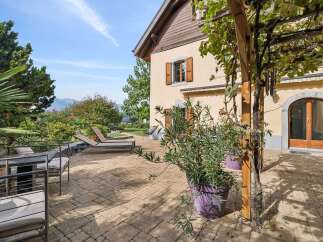 Enjoy outdoor living on this charming patio, perfect for relaxing or entertaining.