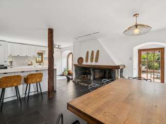 Experience the perfect blend of rustic charm and modern convenience in this open-concept living space.