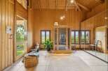 Experience ultimate relaxation and fitness in this beautifully appointed wooden room, featuring a modern infrared sauna and a rowing machine.