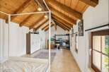 Experience rustic charm and modern comfort in this unique attic bedroom.