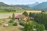 Discover this charming property nestled amidst picturesque rolling hills and majestic mountains.