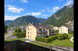 Experience modern living in this stunning apartment complex nestled against a backdrop of majestic mountains.