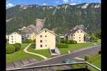 Discover modern living in this scenic residential complex nestled against a majestic mountain backdrop.