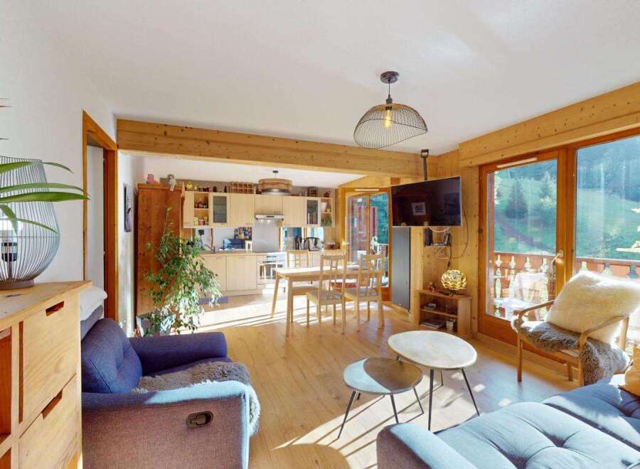 Experience the perfect blend of modern comfort and rustic charm in this inviting open-plan living space.