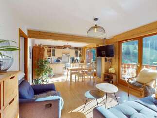 Experience the perfect blend of modern comfort and rustic charm in this inviting open-plan living space.