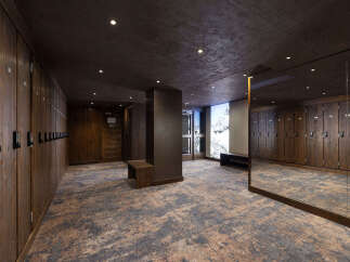 Step into a luxurious ski locker room designed for ultimate comfort and convenience.