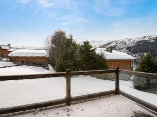 Experience the ultimate winter wonderland from this stunning property's balcony, offering breathtaking panoramic views of snow-capped mountains and charming alpine chalets.