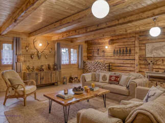 Experience rustic charm in this beautifully appointed log cabin living room.