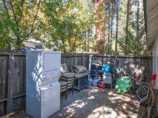 Discover a charming backyard space perfect for outdoor living and storage.